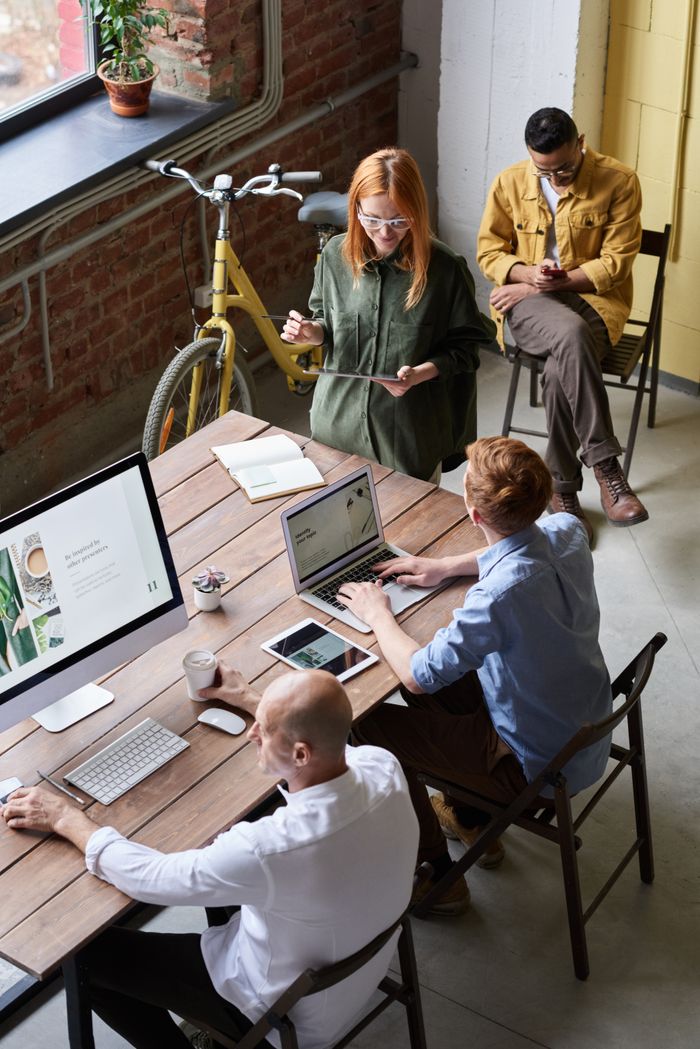 The Art of Drawing Readers In: Your attractive post title goes here Casual workspace with diverse team working and interacting in a modern office.